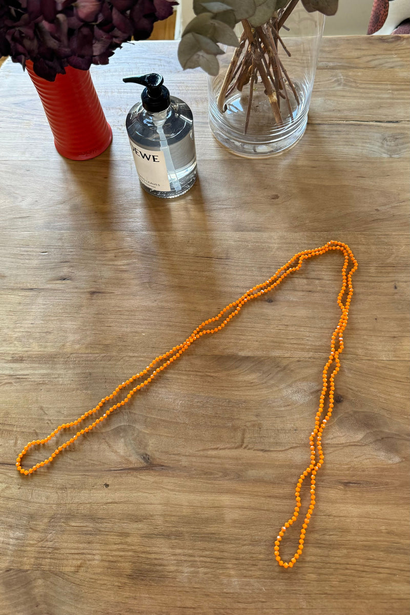 Collar largo de piedras facetadas naranja